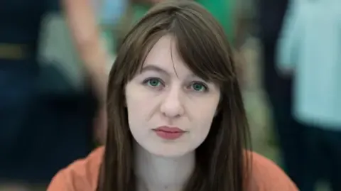 The acclaimed novelist declares she is unable to visit the UK because of arrest fears